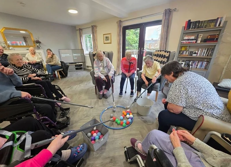 Residents enjoying a fun competition at Broxburn Care Home